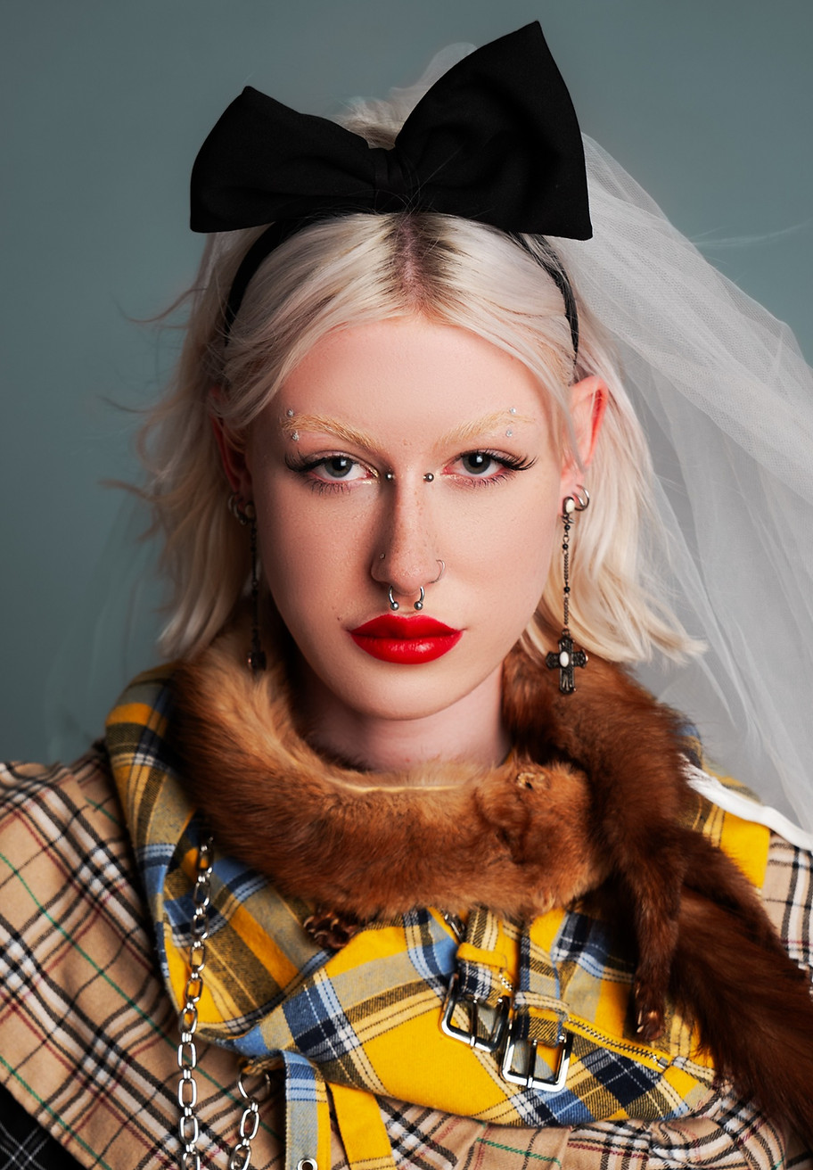 portrait of a female with tartan scarf and a veil